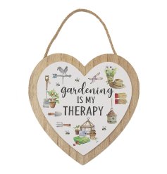 A chic wooden plaque in a heart shape with scripted text and gardening annotations. 