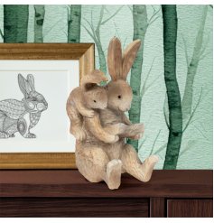 This delightful piece features two adorable hares, Harry balanced on Hatty's back engrossed in a book.