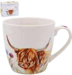 A white china mug with a painted image of a highland cow surrounded by flowers.