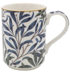 An elegant mug from the Willlow Bough collection detailing a blue and green leaf print pattern. 