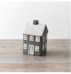 Add charm to any space with this chic grey tea light house, perfect for decorative accents.