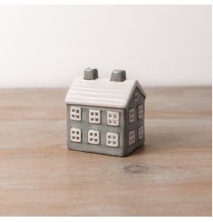 An elegant ceramic t-light house featuring a stylish grey finish
