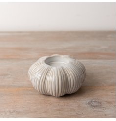 A stunning and on trend pumpkin t-light holder in a reactive glaze finish. The perfect blend of seasonal sophistication 
