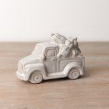 An adorable ceramic pumpkin filled trailer with a natural reactive glaze.