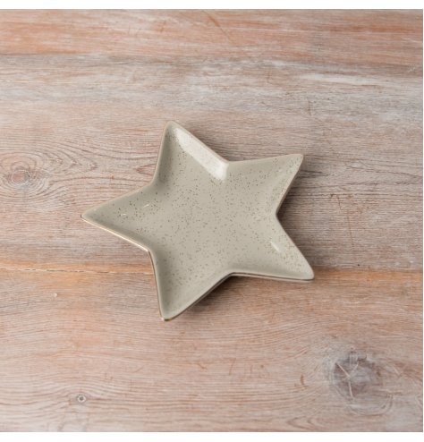 A stunning neutral dish in a star shape featuring a gold trim and speckle, making it perfect for the Christmas season.