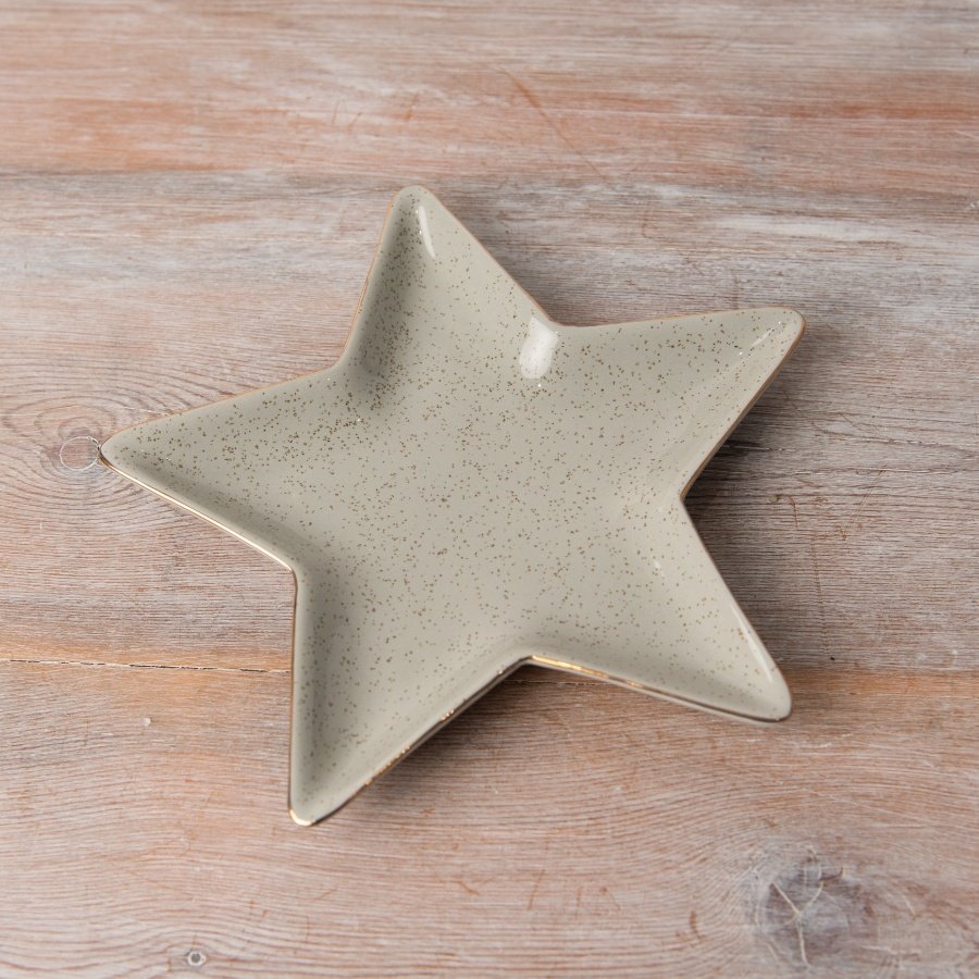 A neutral ceramic dish in a star design.