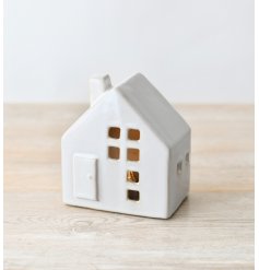A delicate LED house adorned with a reactive glaze finish and windows strategically cut out, crafting a snug and invitin