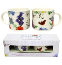 A set of 2 butterfly and flower pattern cups.