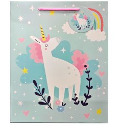 A big charming bag for gifts with a unicorn print.