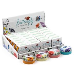 A lip balm in a miniature tin featuring a butterfly meadows design.