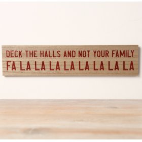 A witty wooden sign adorned with the phrase "Deck the Halls And Not Your Family Falalalalala" in a dark red glitter font
