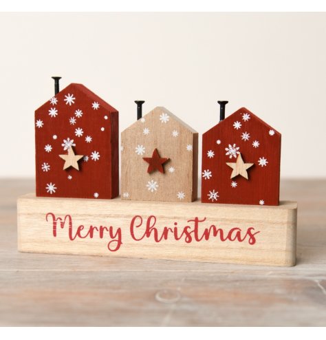 Spread holiday cheer with our delightful Merry Christmas House On Stand Deco. 