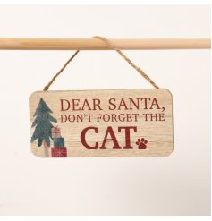 A wooden sign featuring the phrase "Dear Santa, remember the cat," adorned with an adorable paw print and festive decals