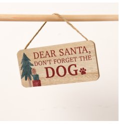 A wooden sign with the saying "Dear Santa, don't forget the dog"