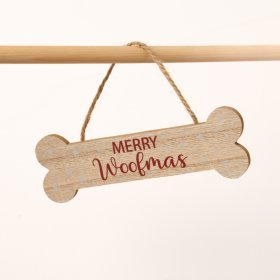 A lovely and charming wooden hanger crafted in the shape of a bone adorned with the words 'Merry Woofmas.'