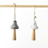 An assortment of two wooden mushroom hangers, available in white and grey
