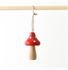 A delightful wooden mushroom hanger in red and white