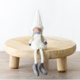 Tiny white doll for decor. Perfect for mantels, shelves, or desks. Adds charm to any space.