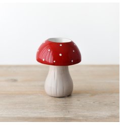A cute candle holder designed in a shape of mushroom.