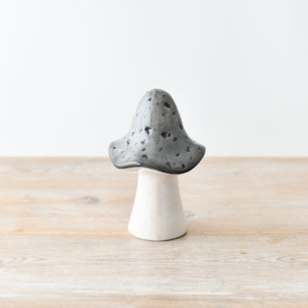 A grey and white ceramic decorative mushroom.