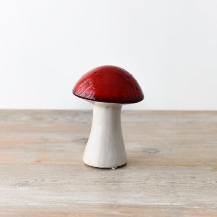 An enchanting red mushroom made from ceramic. Great for adding a touch of whimsy to any home. 