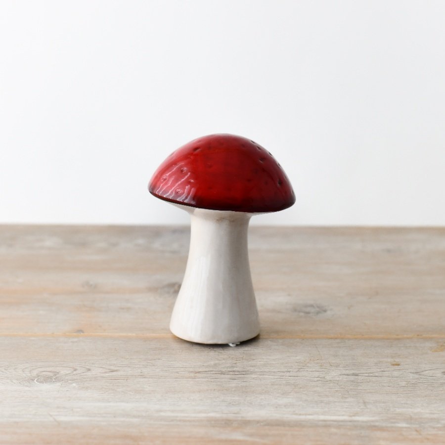 An enchanting and on trend ceramic mushroom in vibrant red.