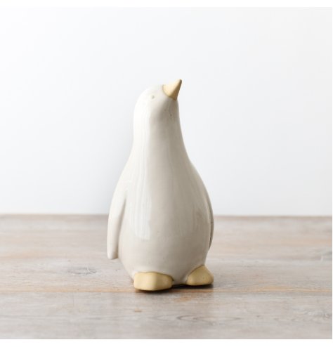 Enhance your home decor with this charming penguin ornament - a perfect touch of cuteness.