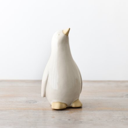 Enhance your home decor with this charming penguin ornament - a perfect touch of cuteness.