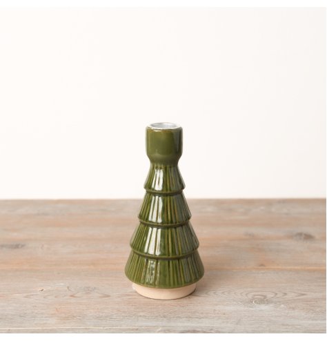 A stunning dinner candle holder in a lush forest green, crafted from ceramic and embellished with a lovely textured glaz