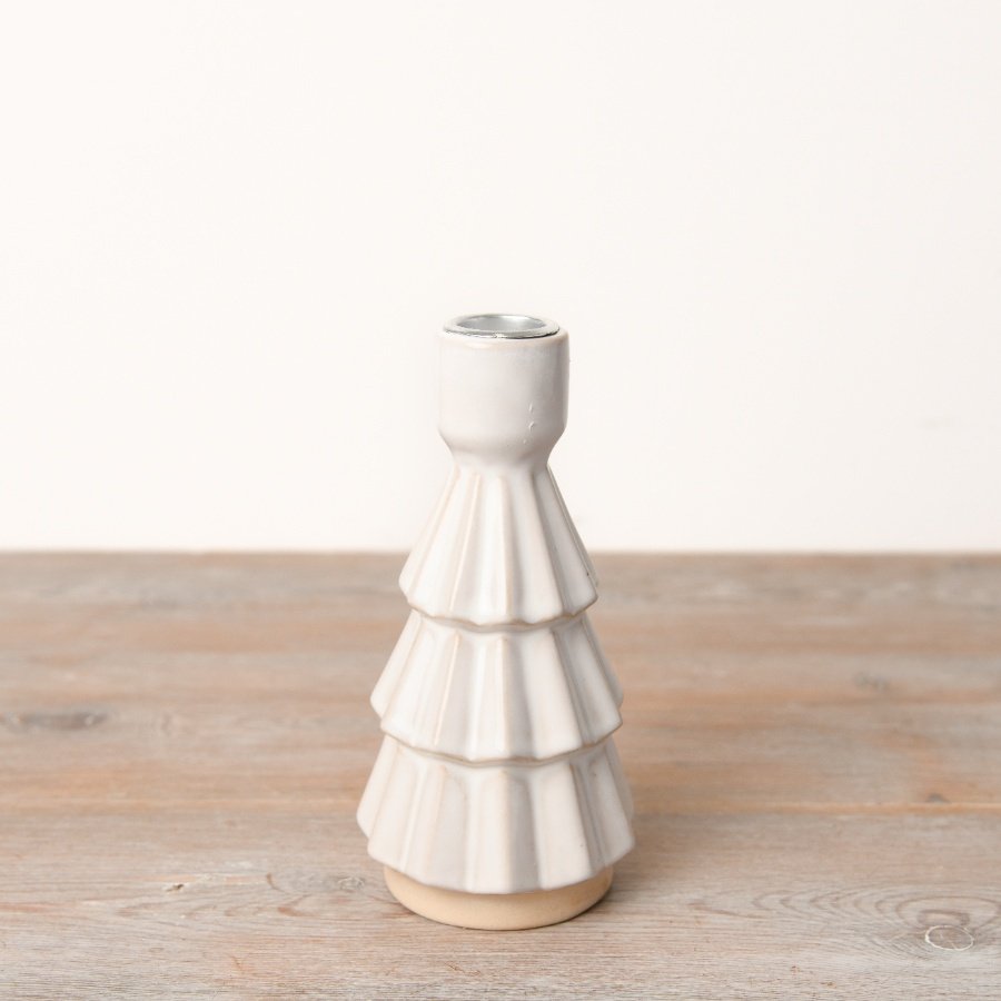 An elegantly simple yet enchanting Christmas tree dinner candle holder.