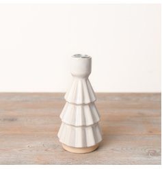 An elegantly simple yet charming Christmas tree dinner candle holder.