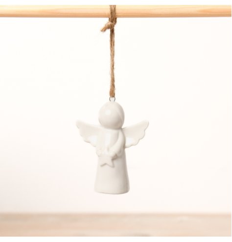 A lovely miniature angel with wings and a star.