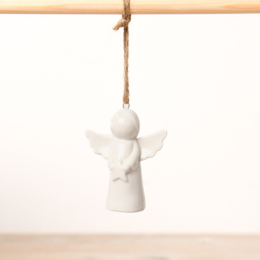 A tiny ceramic angel with a jute string.