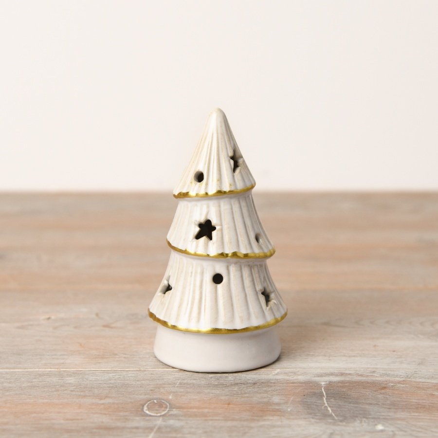 An elegant LED tree with a natural white glaze, gold trim, and intricate star and dot cutouts.