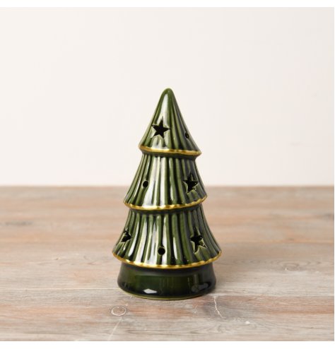 An enchanting forest green LED tree with gold trim, a ribbed texture and delicate star cutouts.