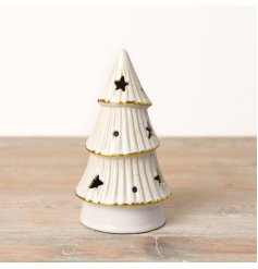 An enchanting LED tree adorned with a natural white glaze, gold detailing, and charming star cutouts.
