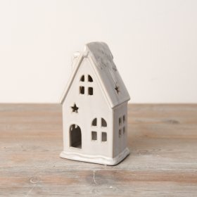 An enchanting LED house featuring a snowy roof and complemented by a reactive glaze finish.