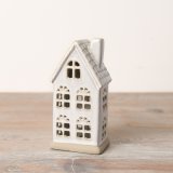 A gorgeously chic LED house featuring delicately cut-out windows, a rustic base, a textured roof