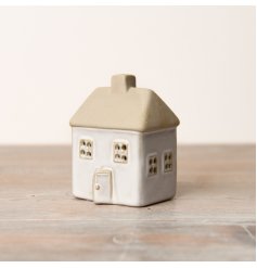 A reactive glaze LED house with a raw roof and embossed decals. Ideal for infusing texture and charm into any area.