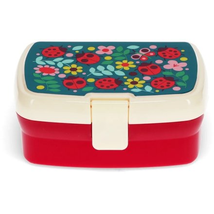 A bright and colourful child's lunch box adorned with pretty ladybird and floral patterns.