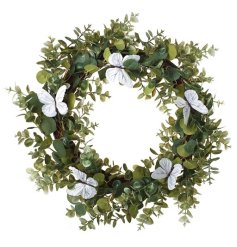 A simplistic and modern wreath adorned with greenery and finished with a handful of intricate white butterflies. 