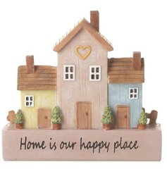 A sweet ornament displaying 3 houses with cute heart and plant details