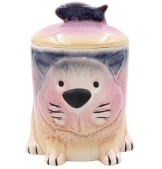 A cat treat storage canister in pink and blue colour tones. 