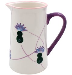 A quaint glazed jug decorated with hand painted thistles and embossed detailing. 