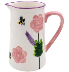 A lovely colourful jug with a flower and bee design.