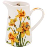 A stylish ceramic jug featuring daffodils and bees.