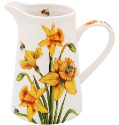 A lovely white jug detailed with yellow daffodils and bees.