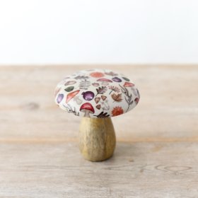 An autumnal mushroom crafted from mango wood and showcasing a glazed patterned top.