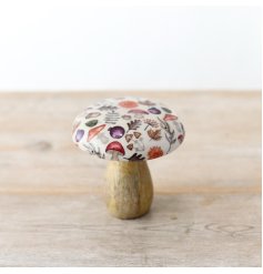 An enchanting mango wood mushroom with a glazed top adorned with a captivating autumnal pattern