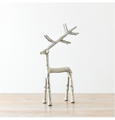 A silver reindeer ornament with a rustic finish